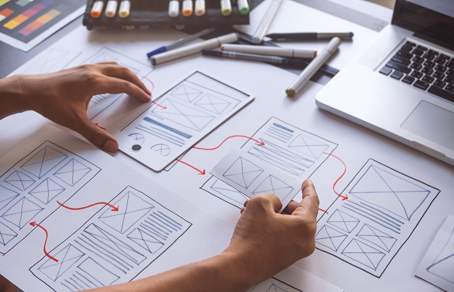 A web designer creating a website wireframe