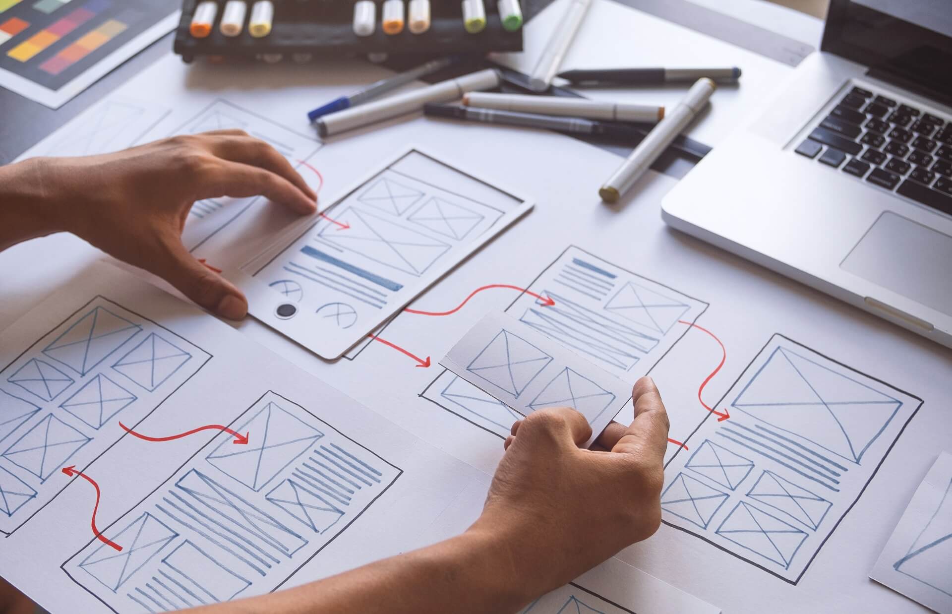 A web designer creating a website wireframe